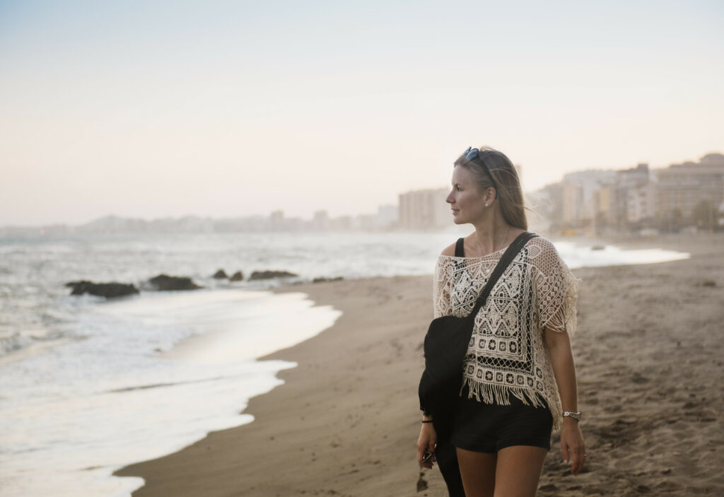 woman walking on beach, torreblanca, fuengirola, spain